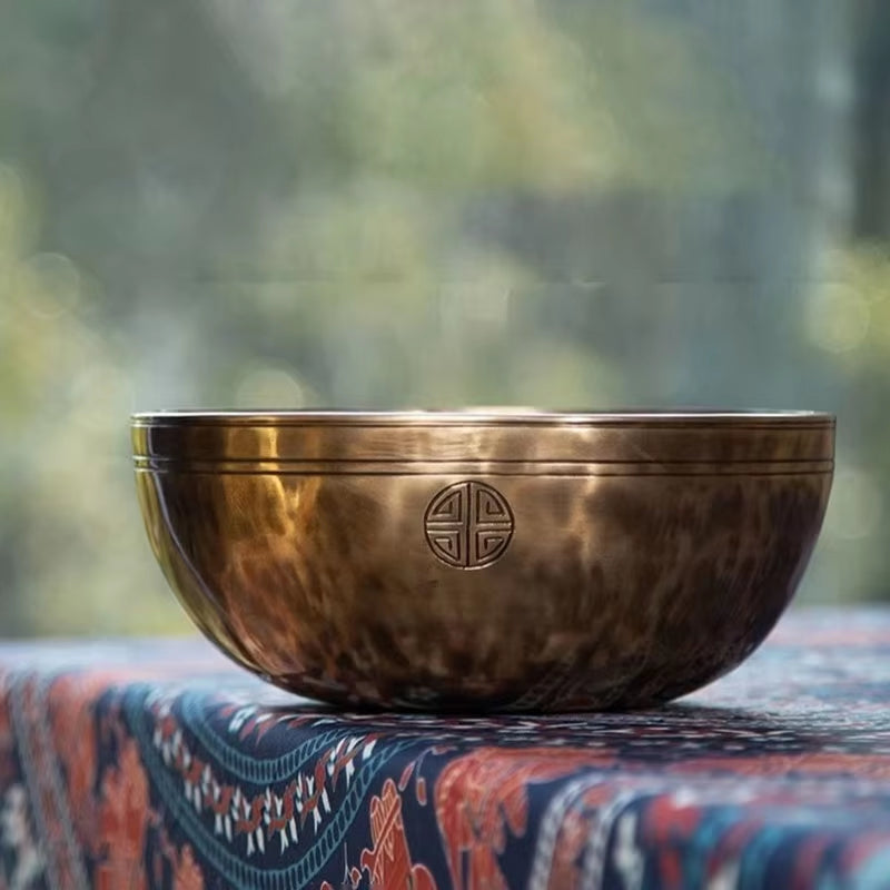 Bronze Tibetan singing bowl with etched symbols in Handmade Full Moon design