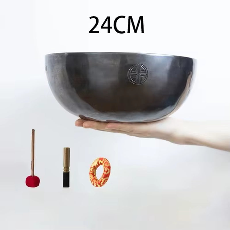 Dark metal Handmade Tibetan Singing Bowl with engraved symbol for meditation and healing