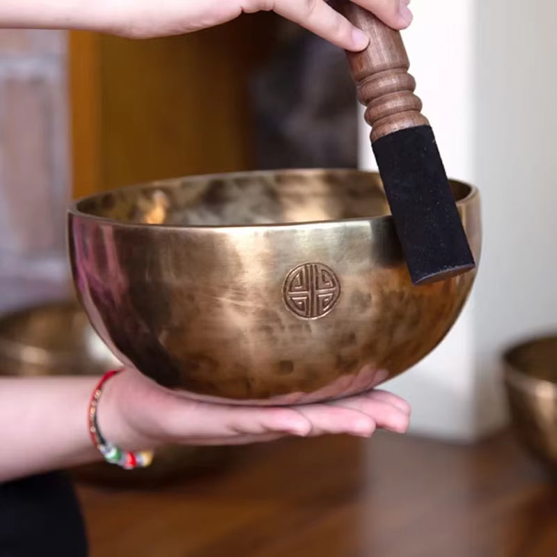 Bronze Tibetan Singing Bowl featuring traditional Buddhist knot symbol design