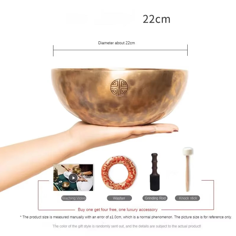 Hand-hammered copper singing bowl with etched symbol design for healing and meditation