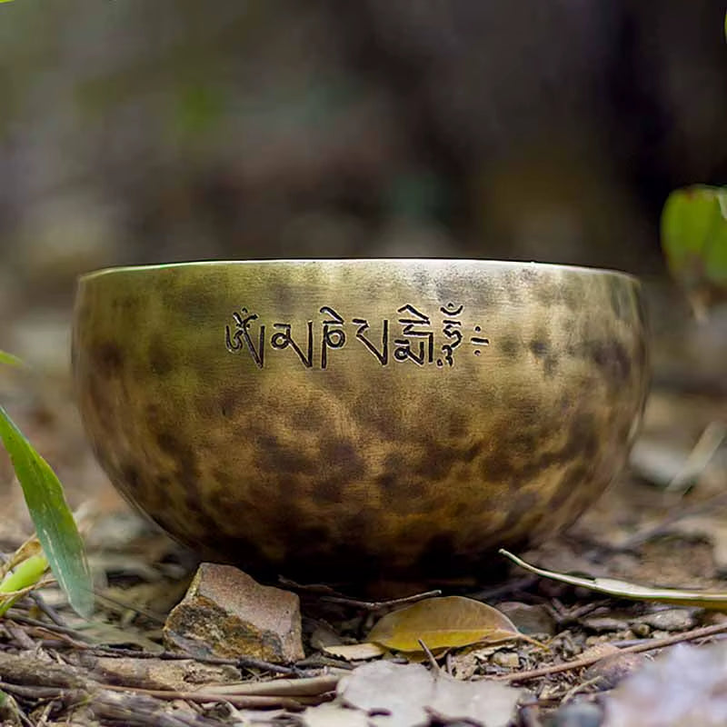 Handmade Tibetan Sound Bowl featuring carved Sanskrit text for healing purposes