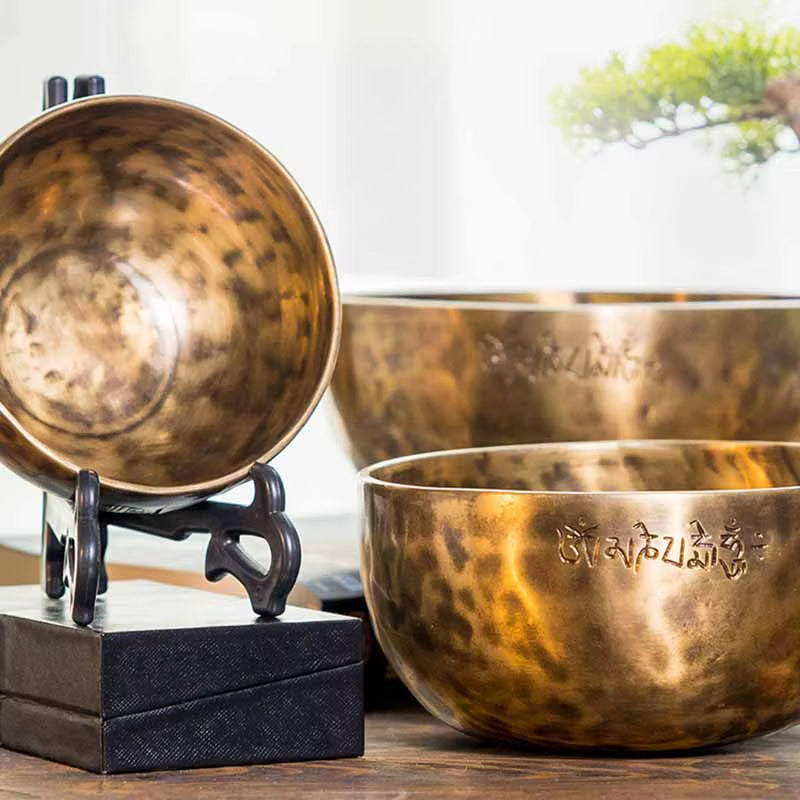 Handmade Tibetan Sound Bowl featuring hammered brass with textured golden surfaces