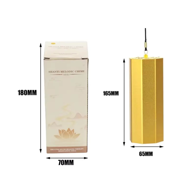 Gold hexagonal pillar with dimensions next to packaging for Hexagonal Metal Koshi Chime Bells