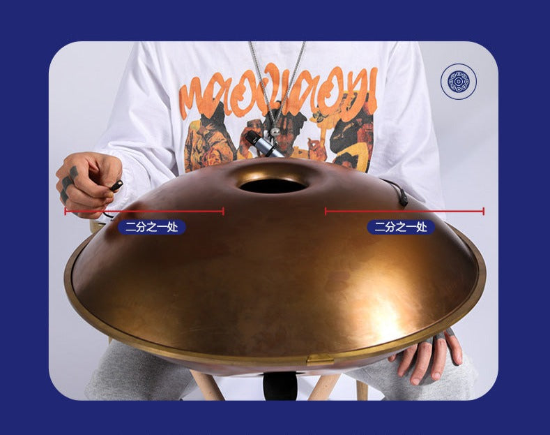 Bronze UFO-shaped percussion instrument with blue measurement lines for Kalimba