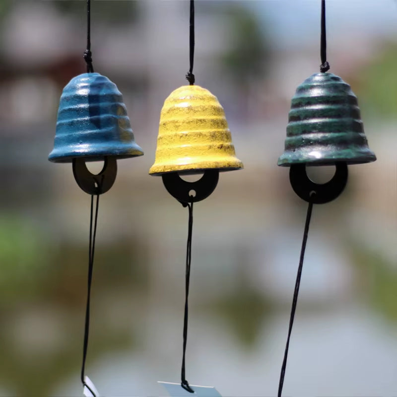 Three colorful Japanese Cast Iron Wind Chimes in blue, yellow, and green for garden decor