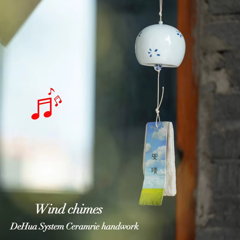 Ceramic wind chime with a white bell and tag, perfect for Japanese outdoor decor