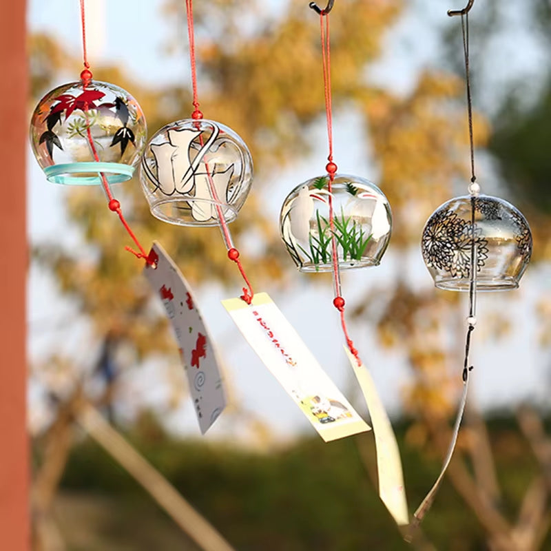 Japanese Glass Wind Chimes with Painted Designs Hanging from Red Strings