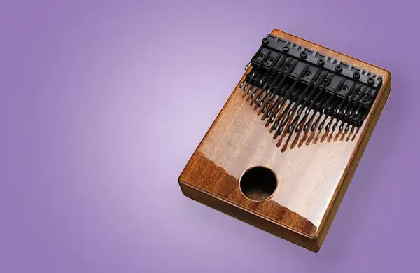 Wooden kalimba with black metal tines and a circular sound hole.