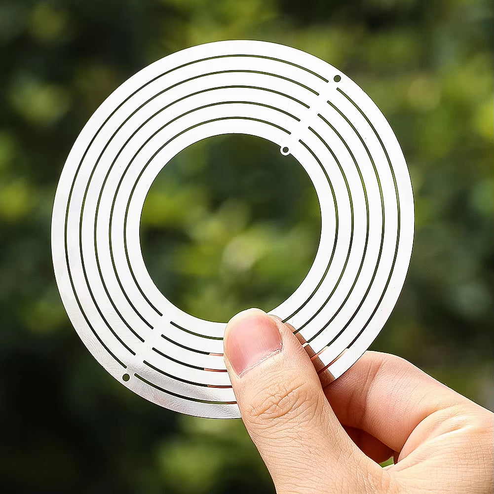 Kinetic Metal Wind Spinner with circular white ring and spiral grooves for garden decor