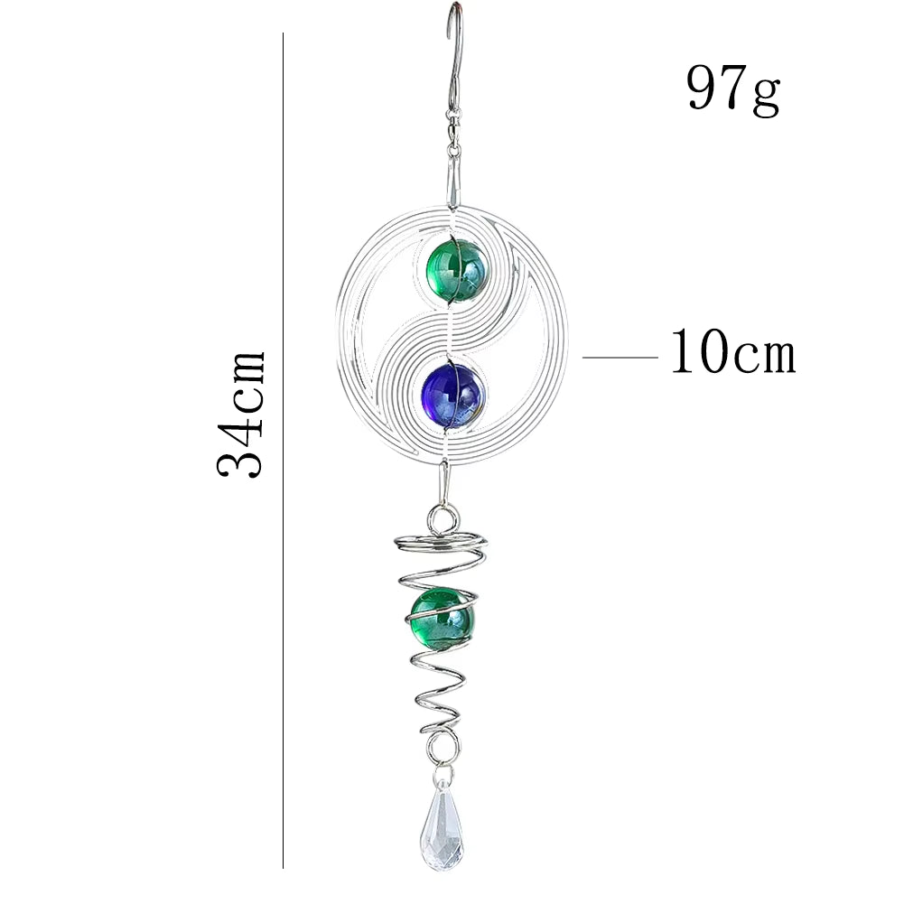 Spiral wire ornament with blue and green beads on Kinetic Metal Yin Yang Wind Spinner