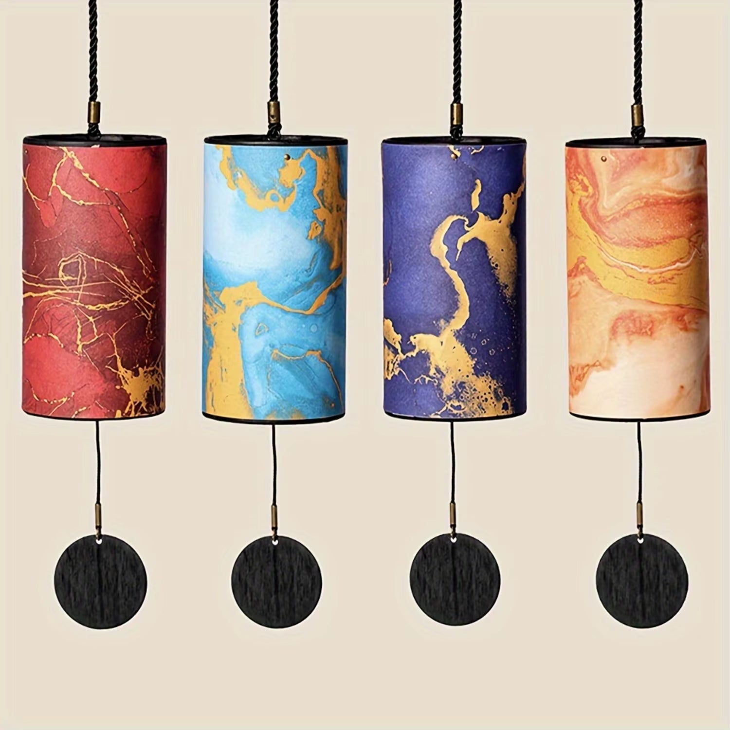 Four decorative cylindrical pendant lamps with marbled red, blue, and gold patterns