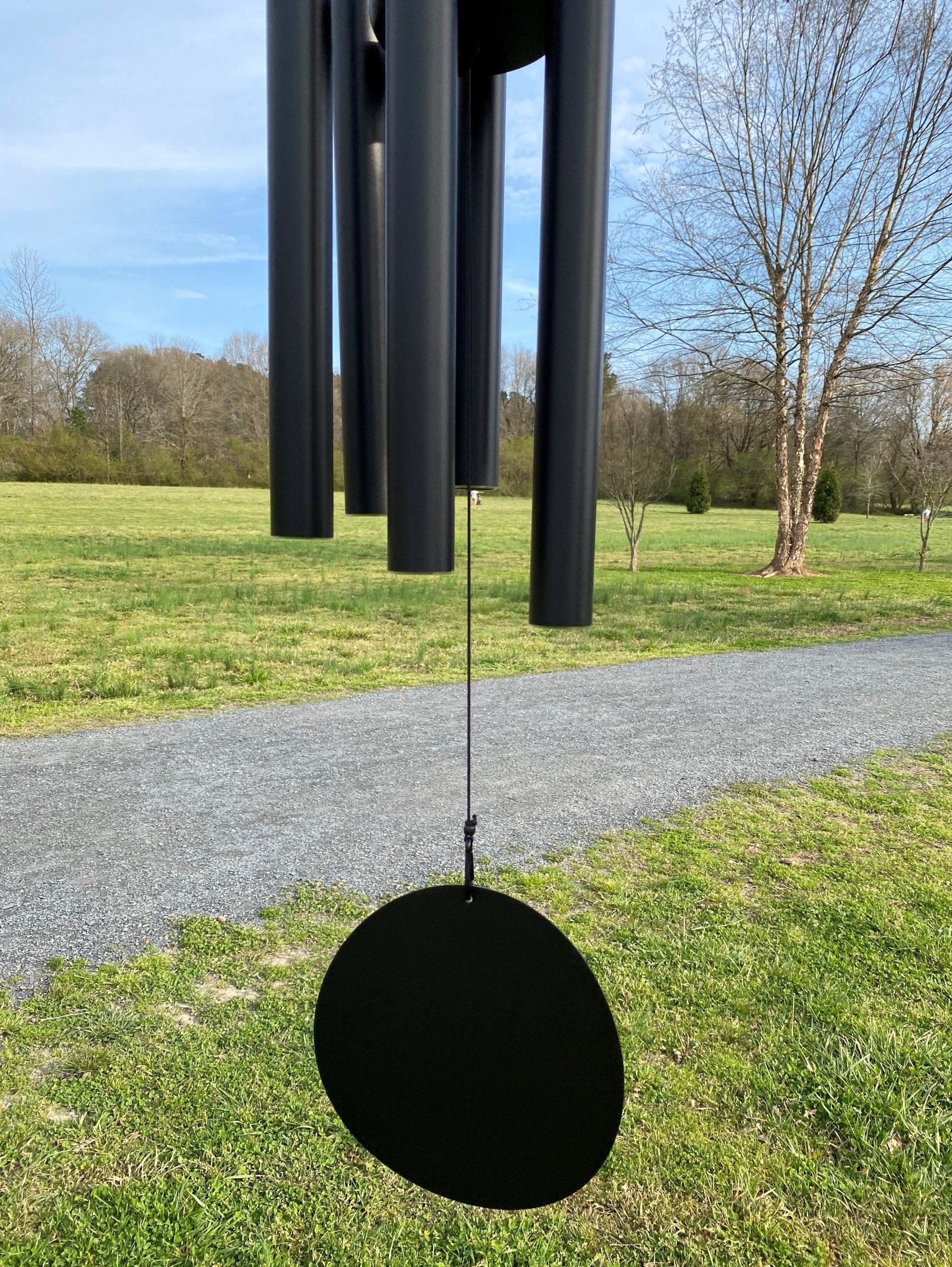 Black spherical pendant on thin cable of Large Deep Tone 60’’ Memorial Wind Chimes