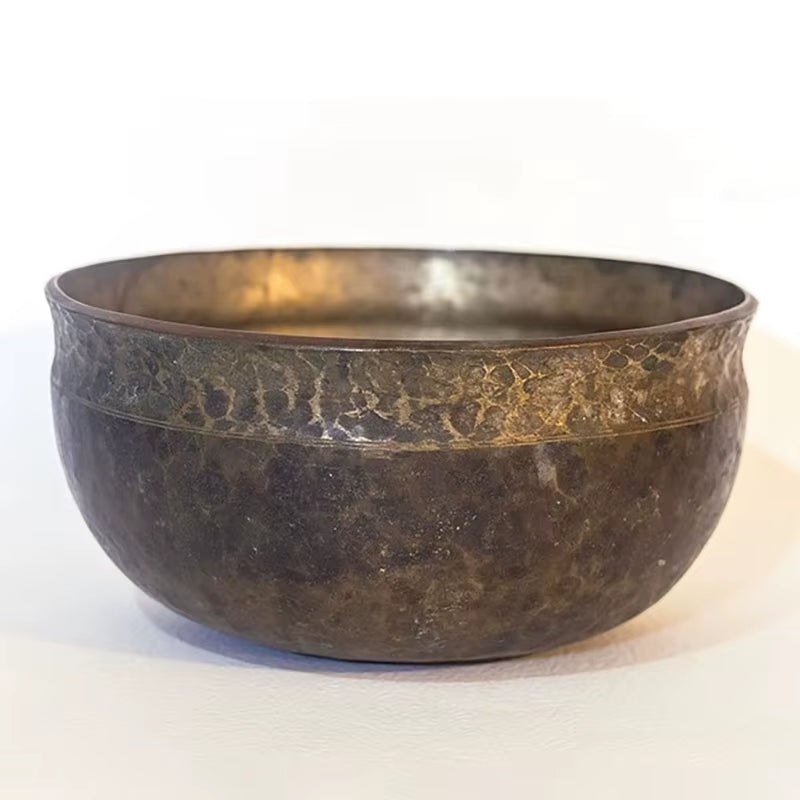 Hammered metal bowl with dark patina, metallic interior for Tibetan meditation and yoga