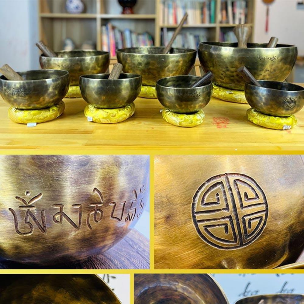 Tibetan singing bowls with symbols on yellow cushions in Large Tibetan Singing Bowl