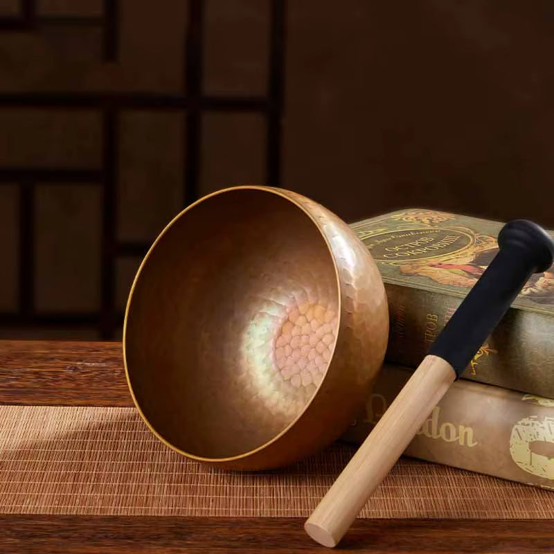 Tibetan singing bowl with wooden striker from Large Tibetan Sound Bowls & Healing Therapy