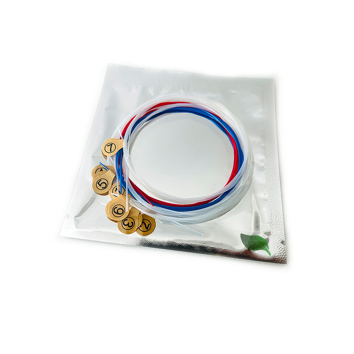 Red and blue wires attached to gold contacts in Lyre Harp Nylon Strings package