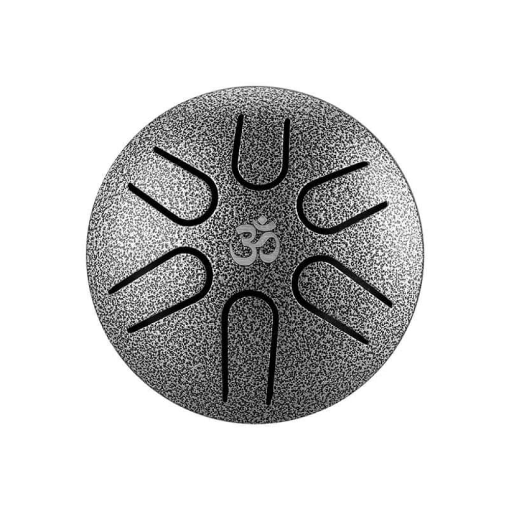 Circular Steel Tongue Drum with Om Symbol and Radial Slits in A5 Pocket Drum