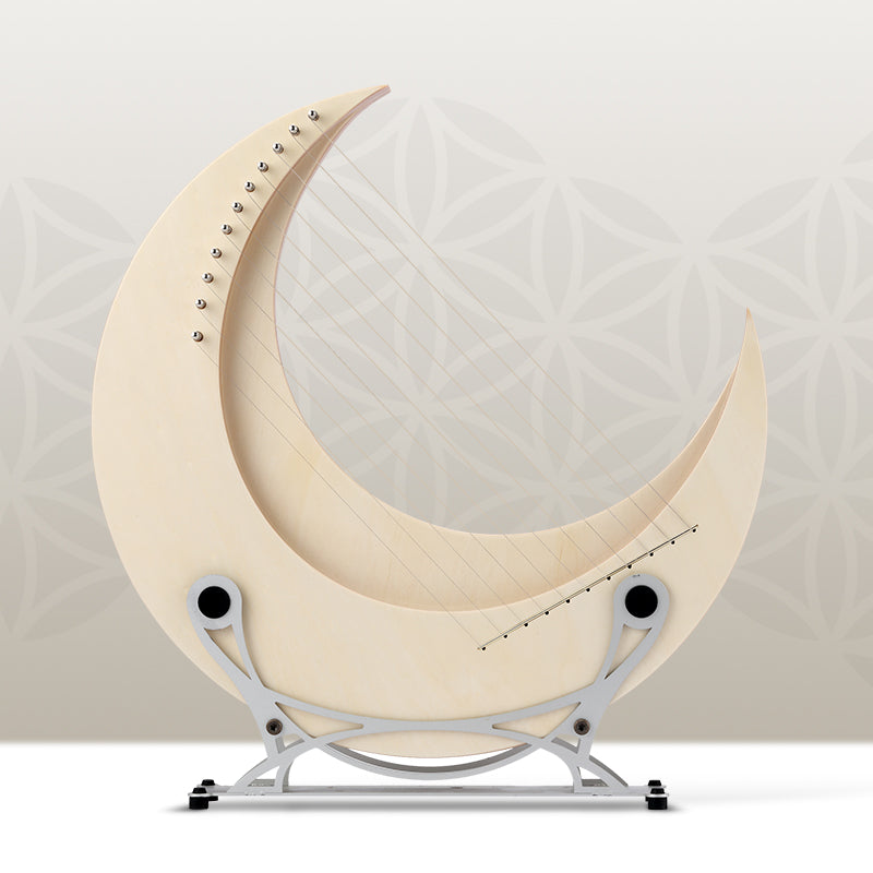 Cream-colored crescent moon on silver stand for Moon Lyre Harp Instrument