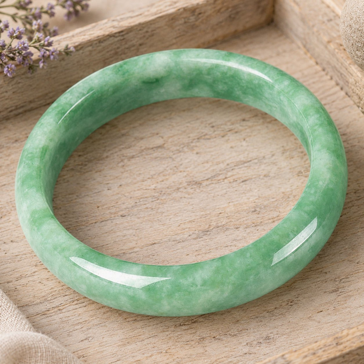 Natural Jade Prosperity Bangle Bracelet 60-61mm, bangle lying at an angle