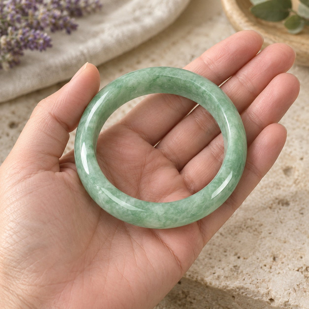 Natural Jade Prosperity Bangle Bracelet 60-61mm, held in the hand to show its real size