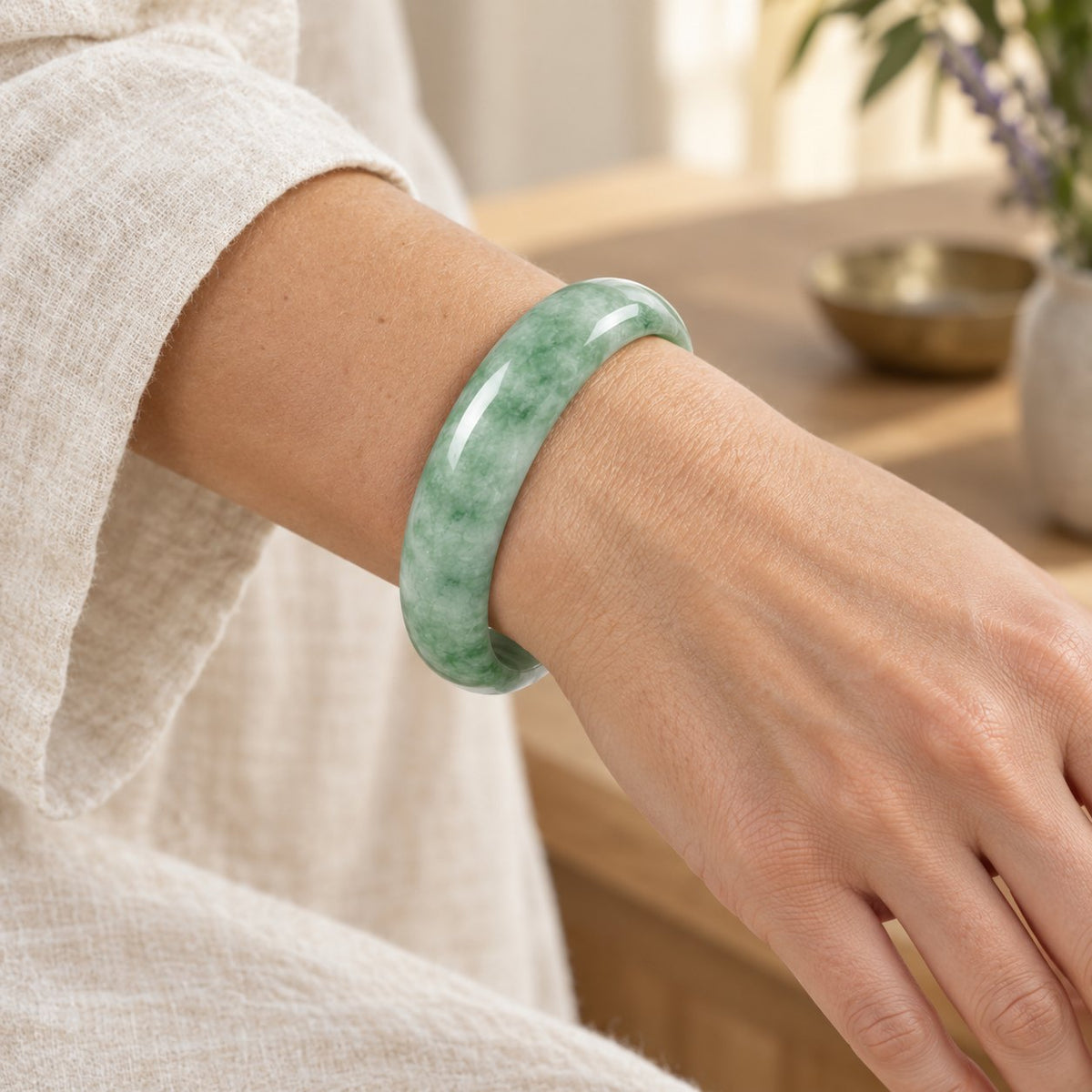 Natural Jade Prosperity Bangle Bracelet 60-61mm, worn on the wrist by a woman