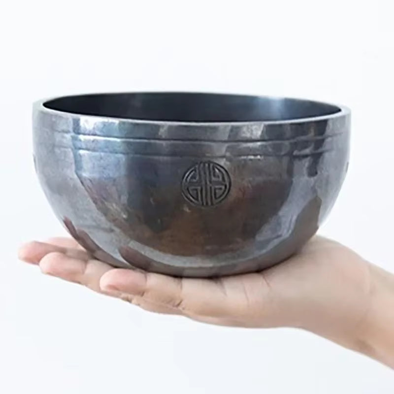 Dark metallic singing bowl with engraved symbol from Nepal Handmade Buddhist Sound Bowls