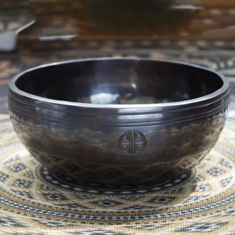 Dark metallic singing bowl with engraved pattern from Nepal Handmade Buddhist Sound Bowls