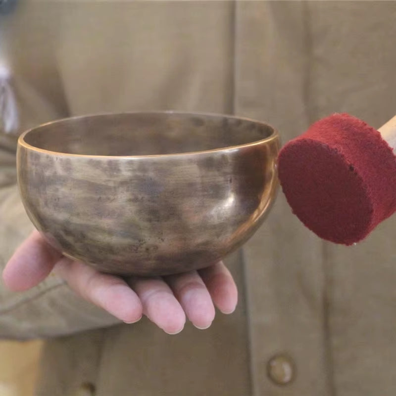 Tibetan singing bowl struck with a red mallet, Nepal Handmade product