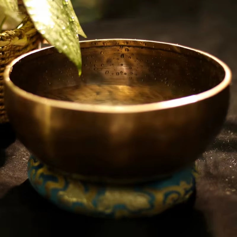 Tibetan singing bowl on a decorative cushion in Nepalese Handmade Brass design