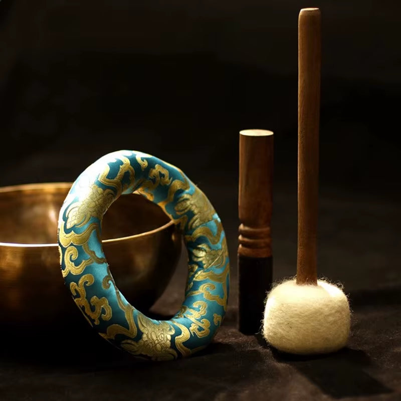 Ornate turquoise and gold circular bracelet with decorative patterns for Nepalese bowl