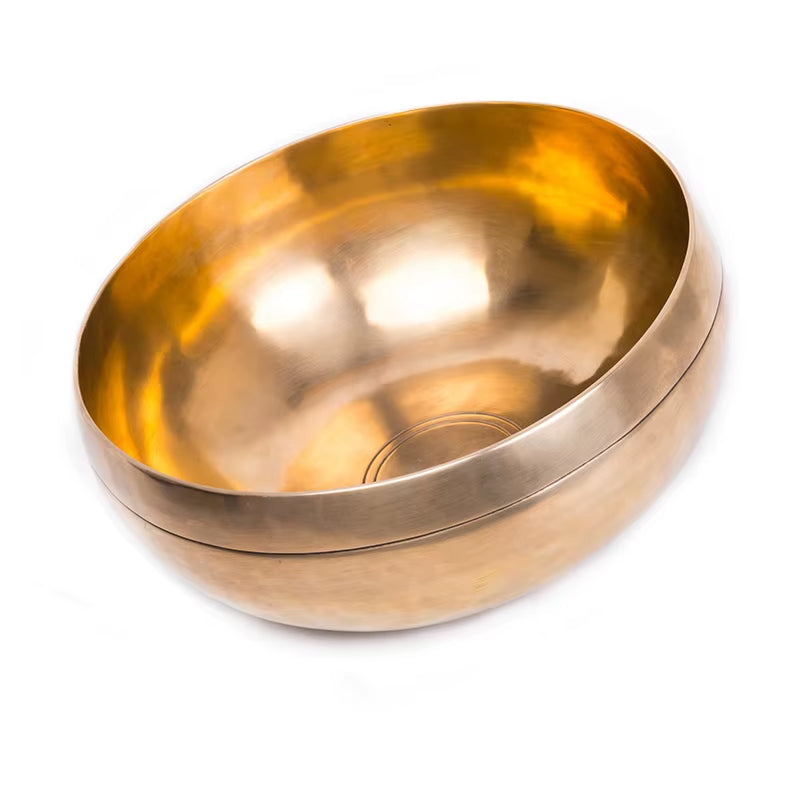 Golden metallic Nepalese Tibetan Singing Bowl for sound healing with smooth shape