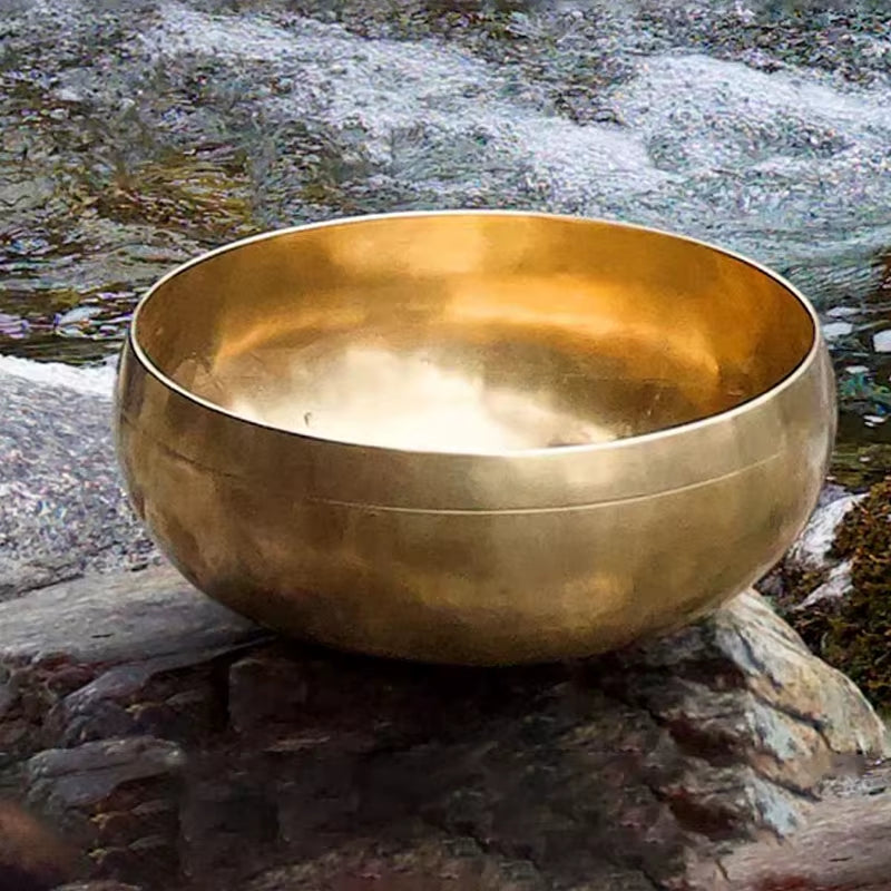 Golden Tibetan singing bowl with smooth shape for sound healing from Nepal