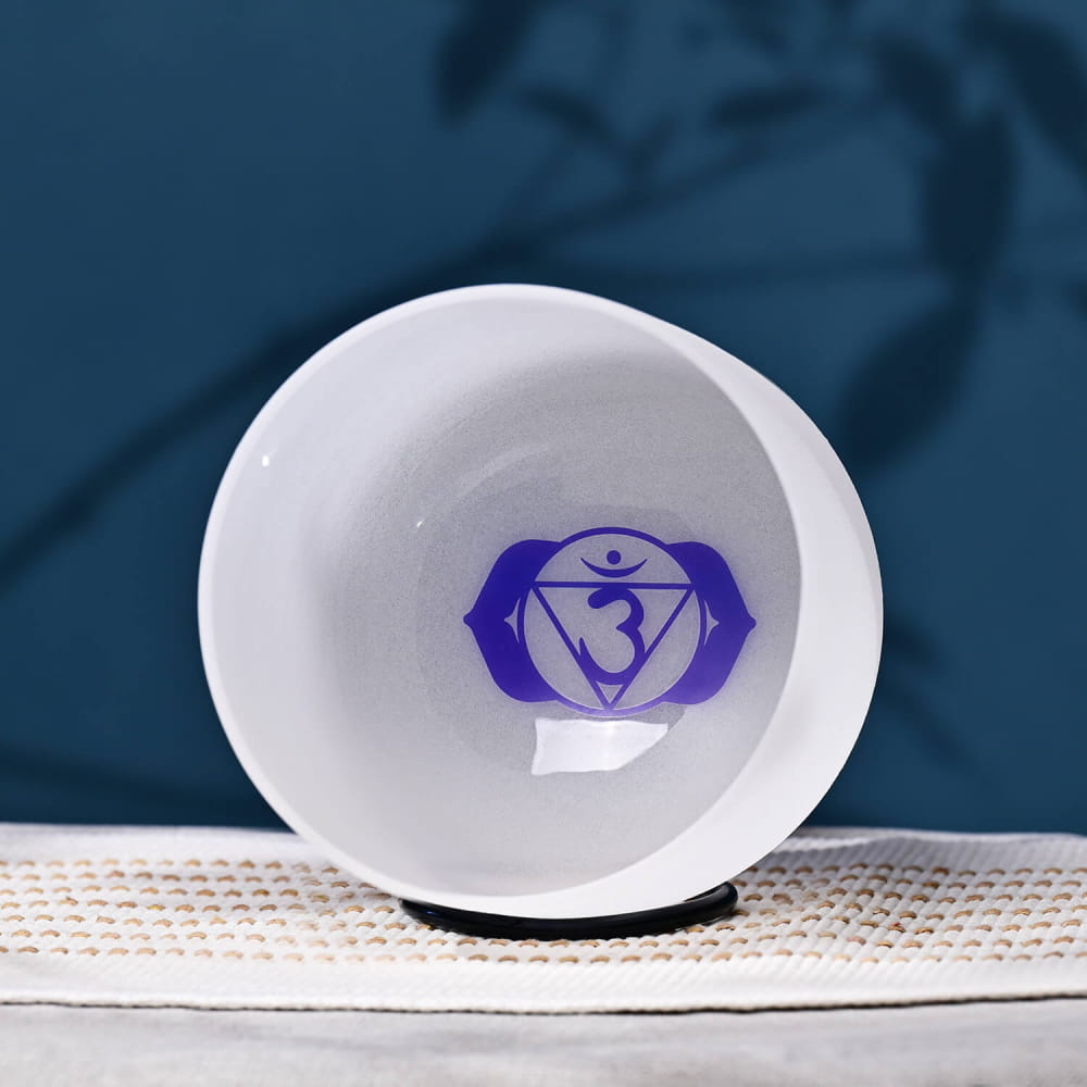 White bowl featuring a purple Third Eye Chakra symbol for sound therapy