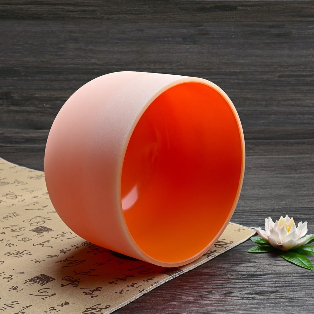 Cylindrical ceramic vessel with white exterior and orange interior for Chakra singing bowl