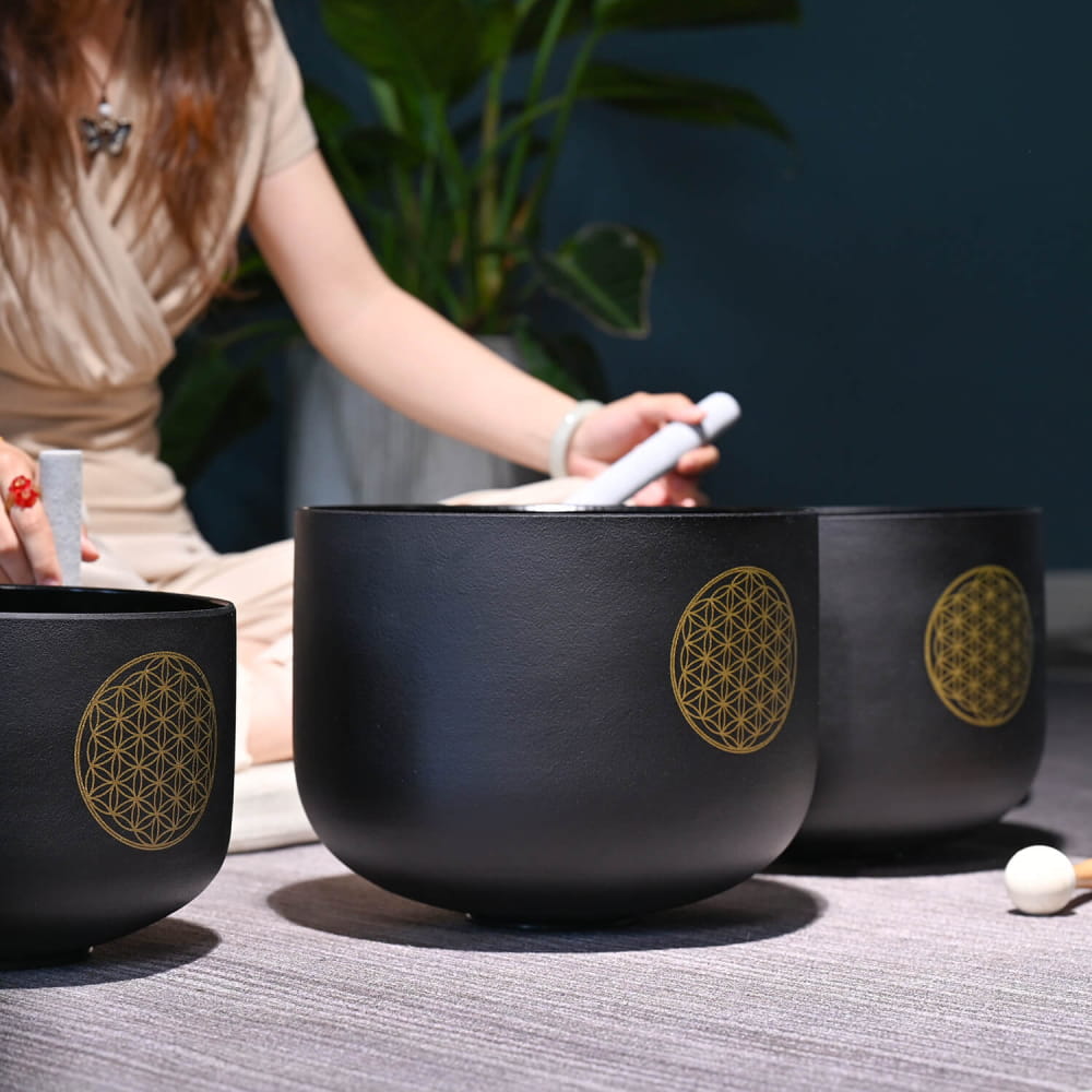 Matte black crystal singing bowls with golden Flower of Life symbols in set