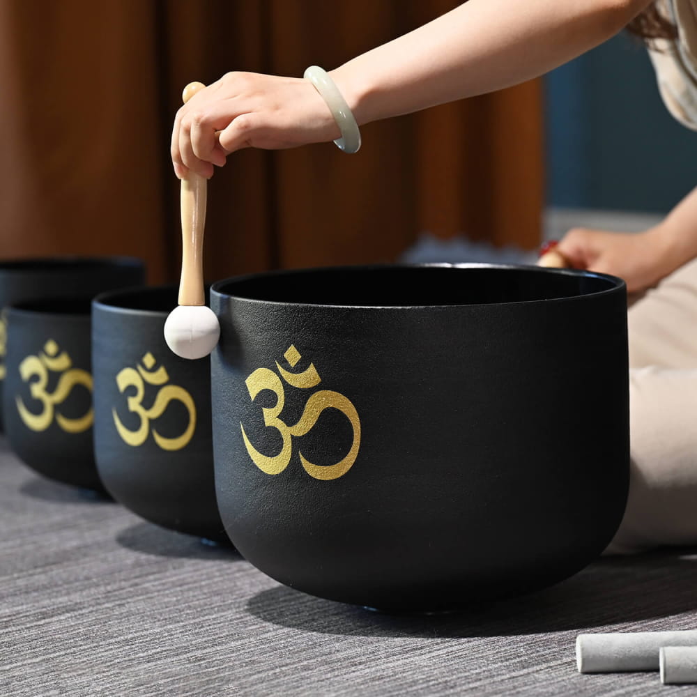 Black singing bowls with golden Om symbols in Perfect Pitch Black OM Symbol set