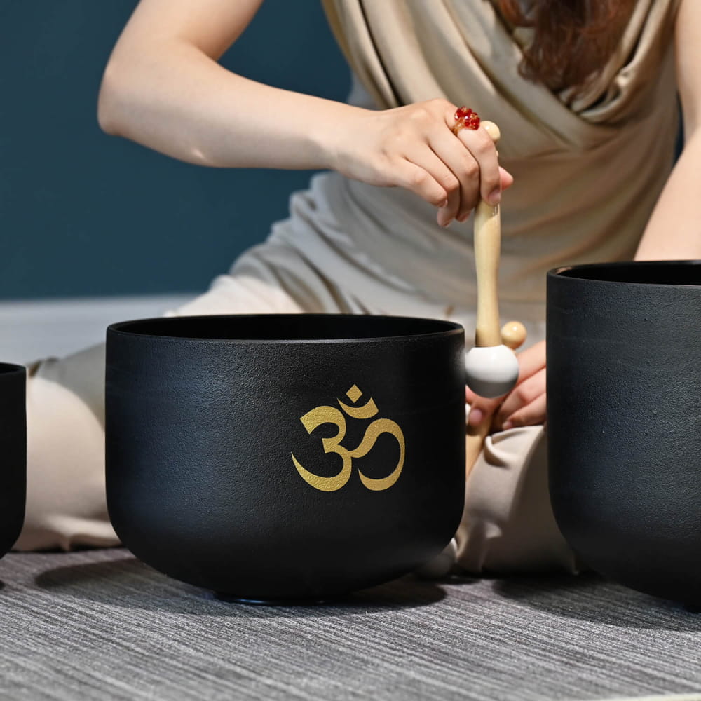 Black singing bowl with golden Om symbol in Perfect Pitch Black OM Symbol set