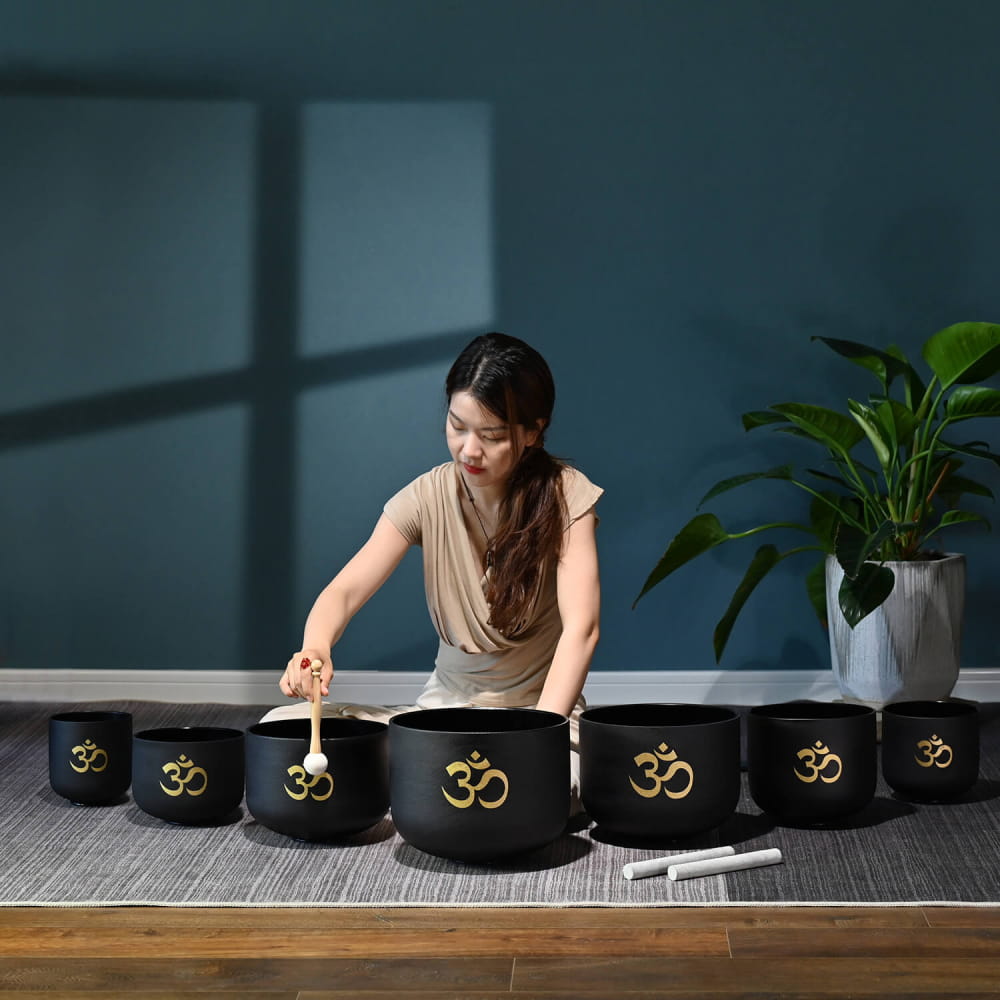 Perfect Pitch Black OM Symbol Crystal Singing Bowl Set with gold symbols on black bowls