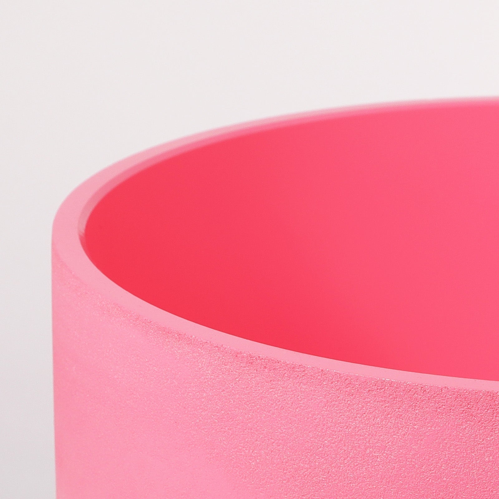 Pink cylindrical container with curved rim for Pink Chakra Crystal Singing Bowl healing