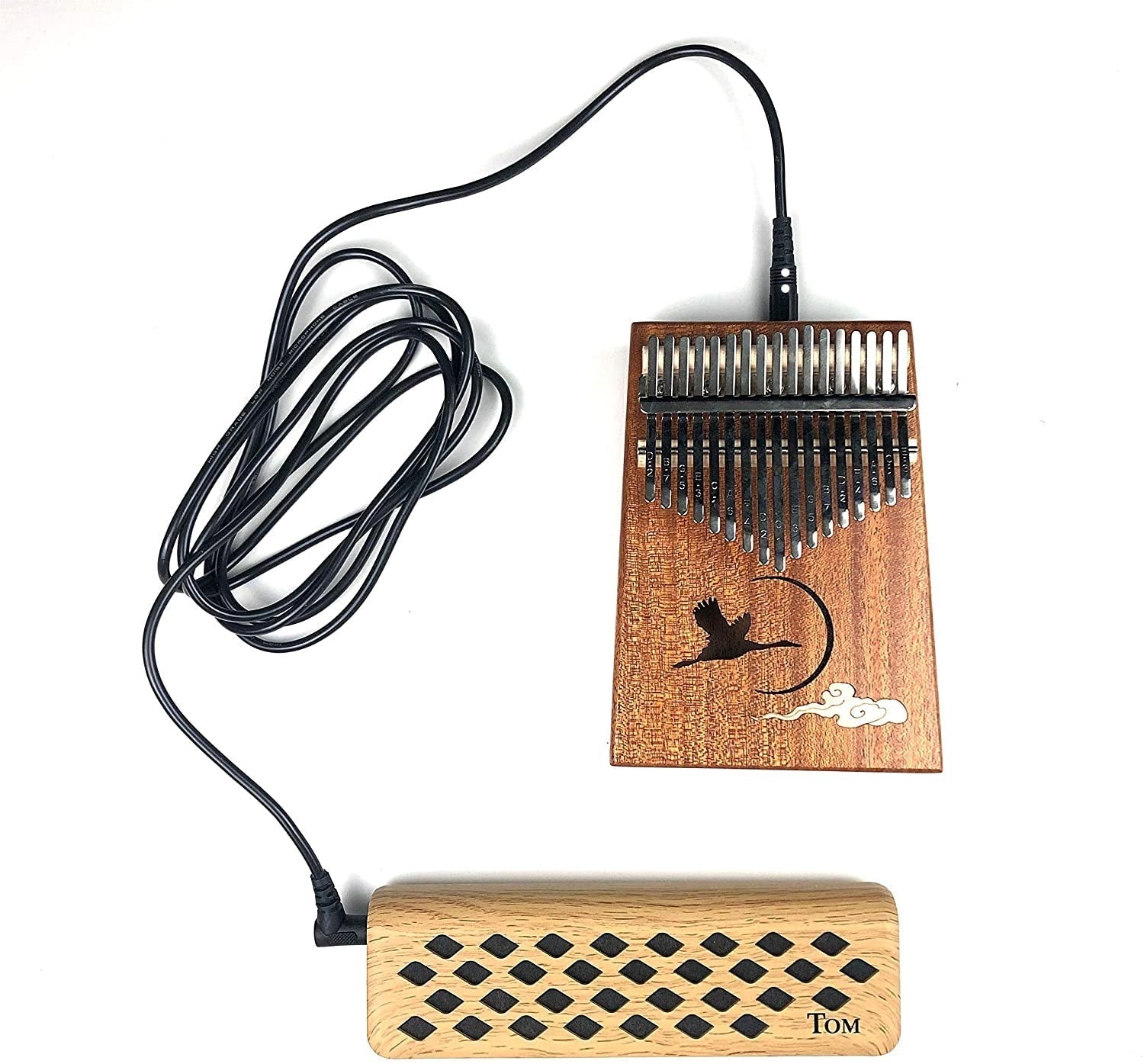 Electric Kalimba with wooden body and diamond-pattern speaker for portable amplification