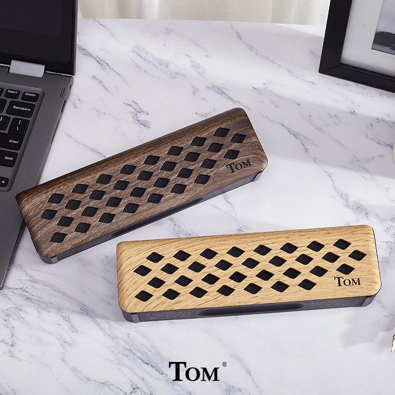 Wooden pencil cases with diamond cutouts and TOM branding for musical instrument accessories