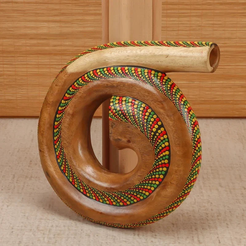 Spiral-shaped wooden horn with red and green beads on Portable Spiral Didgeridoo