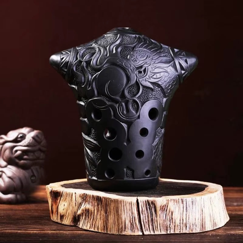 Black ceramic tea strainer with dragon carvings for Xun Flute enthusiasts