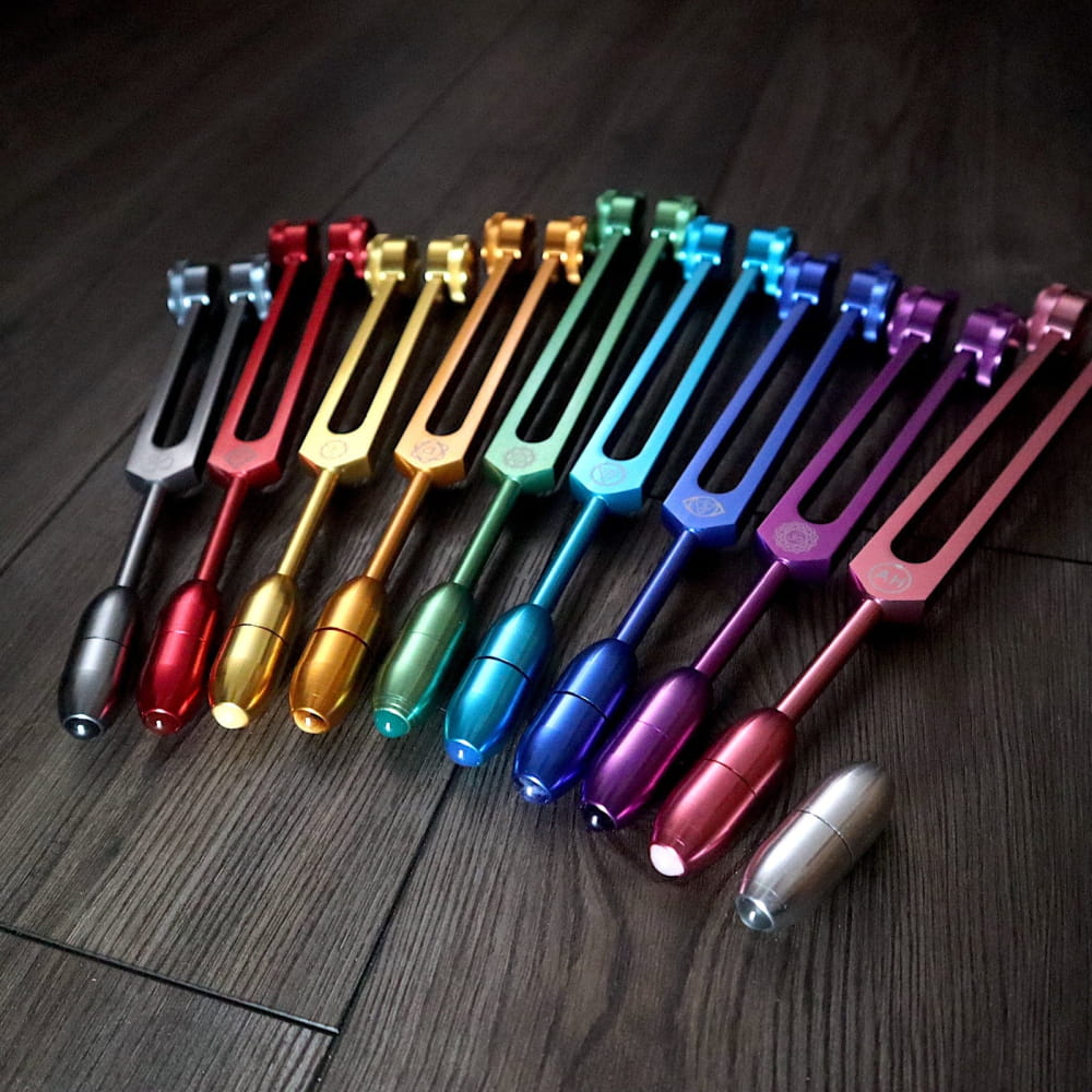 Colorful metallic tuning forks in rainbow spectrum for Solfeggio Crystal Massage Set