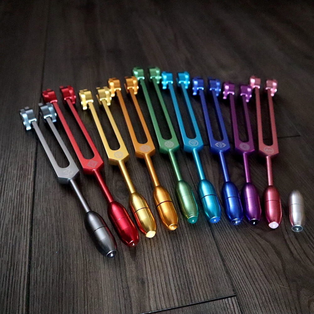 Colorful metallic tuning forks in a rainbow spectrum for Solfeggio Crystal Massage Set