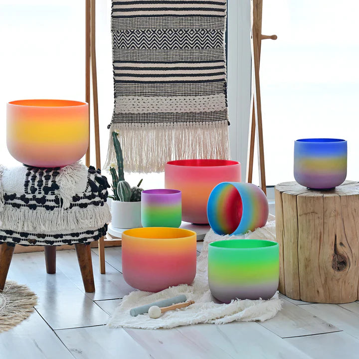 Colorful gradient glass vessels with rainbow ombré effects in a singing bowl set