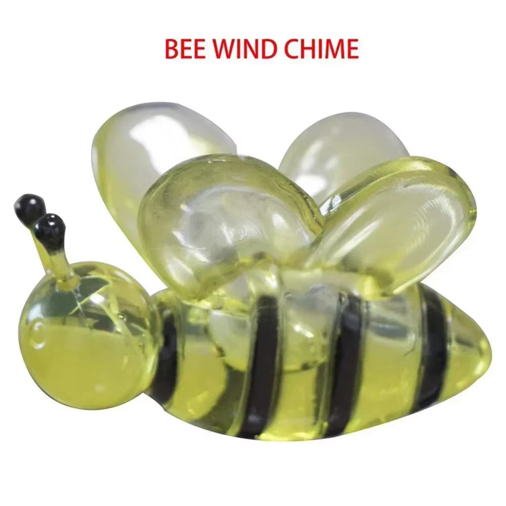 Decorative yellow and black striped glass bee wind chime with translucent wings