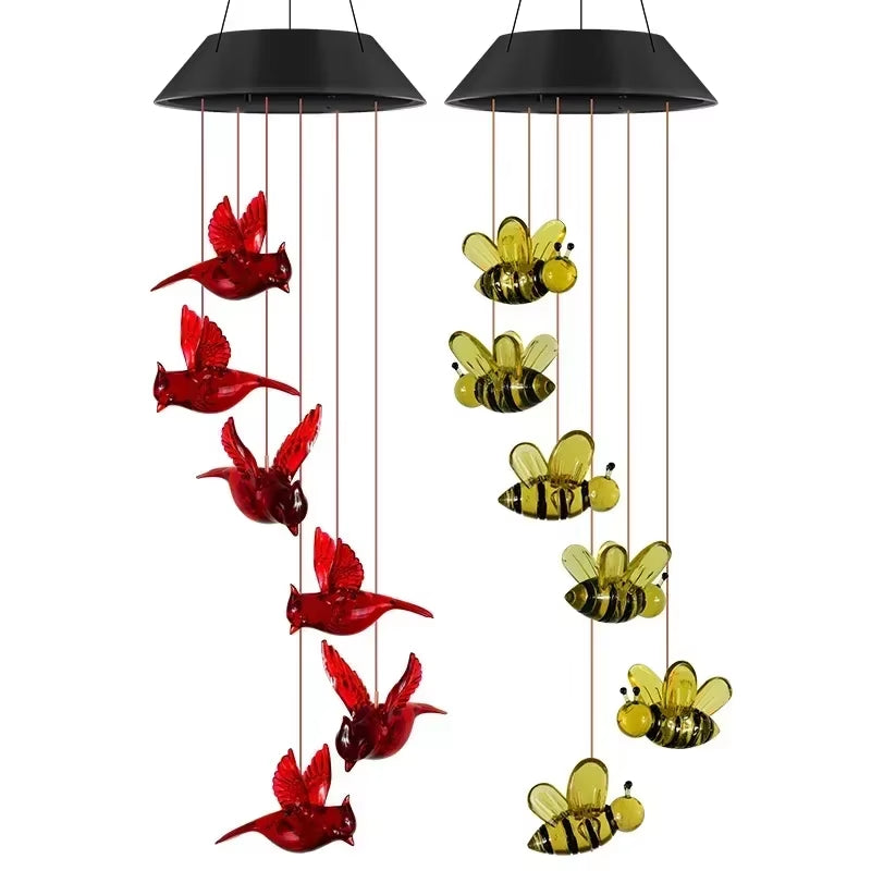 Solar Angel Wind Chime Light with Cardinals and Bumblebees hanging from black domes