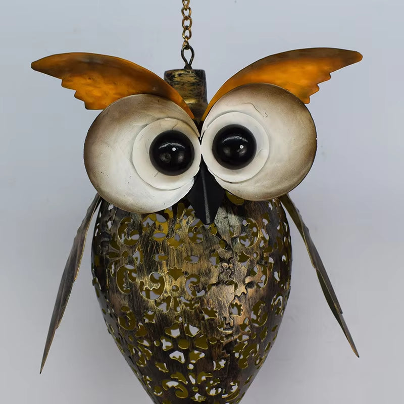 Decorative metal owl sculpture with LED light in Solar Owl Wind Chime design