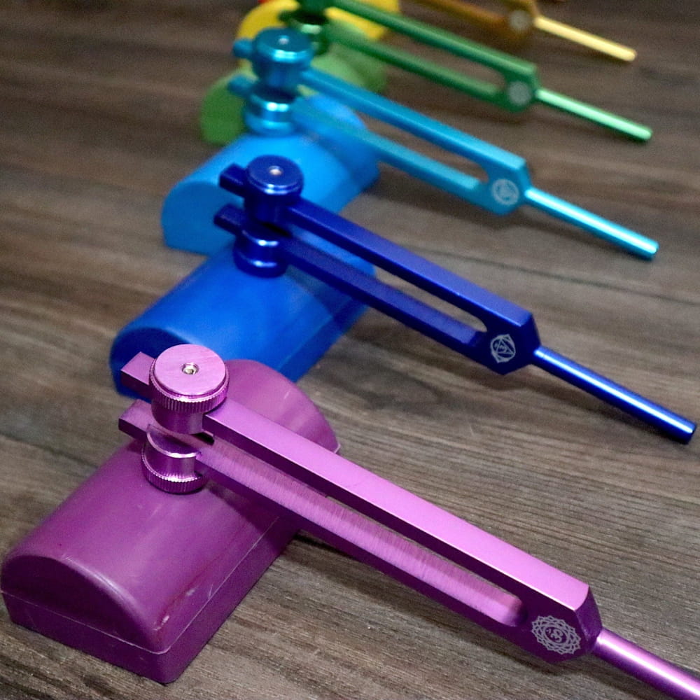 Colorful hex keys arranged in a rainbow pattern for Solfeggio Tuning Fork Set